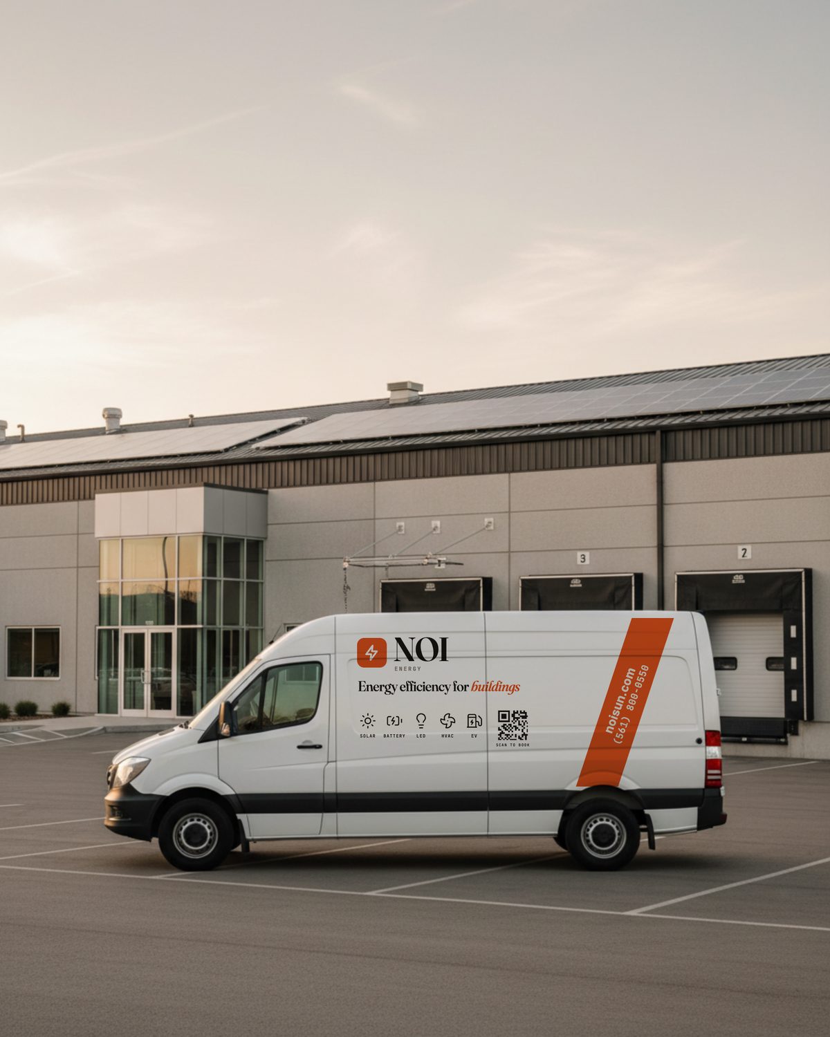 NOI Energy service van outside a commercial building with rooftop solar